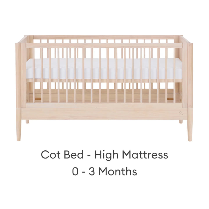 Gaia Baby Eos convertible cot in all-natural wood finish with mattress in high newborn position for 0–3 months on a white background.