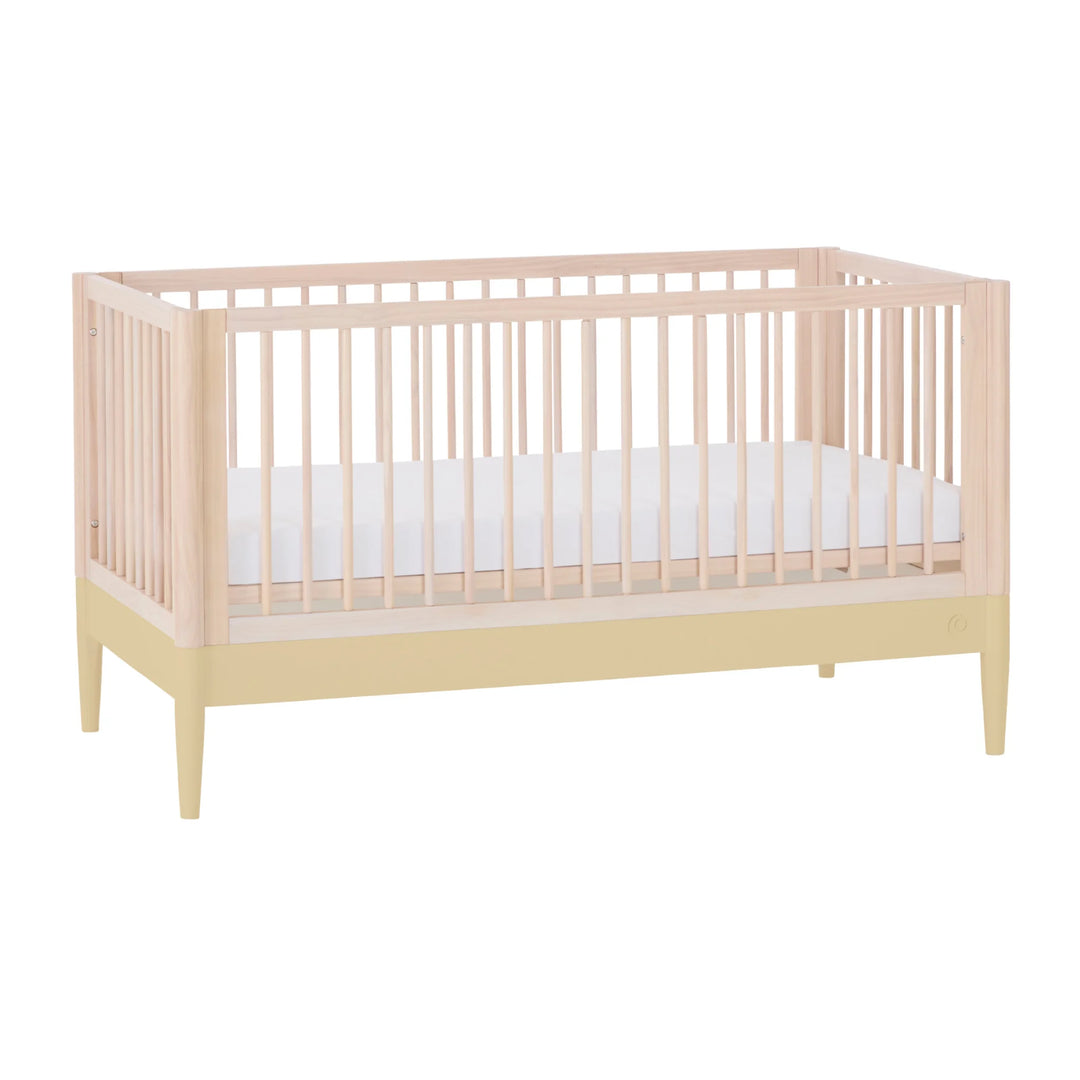 Gaia Baby Eos convertible cot bed in natural wood and yellow with white mattress, modern nursery crib
