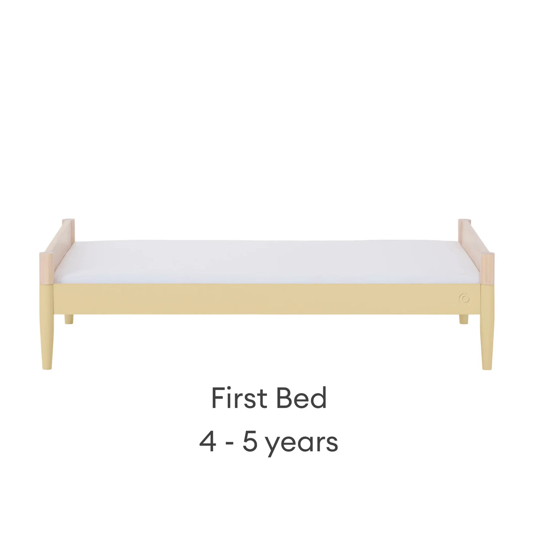 “Gaia Baby Eos convertible cot bed in natural wood and yellow converted to first bed for child (4–5 years)”