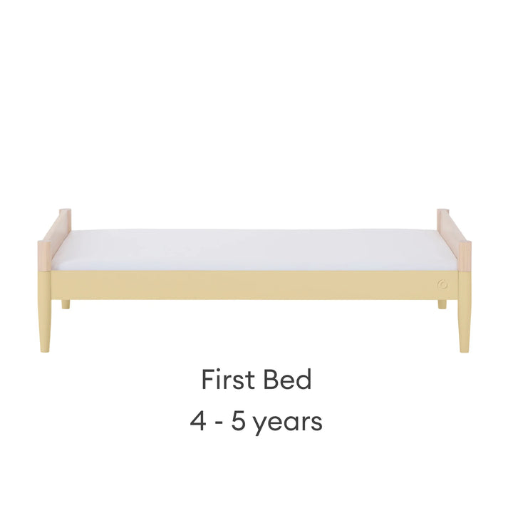 “Gaia Baby Eos convertible cot bed in natural wood and yellow converted to first bed for child (4–5 years)”