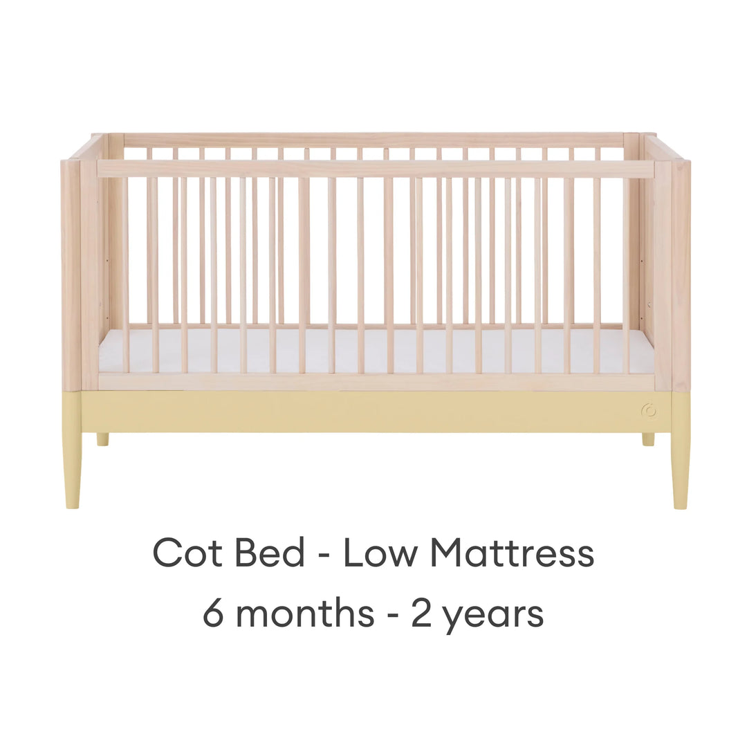 Gaia Baby Eos convertible cot bed in natural wood and yellow with low mattress setting for baby and toddler (6 months–2 years)