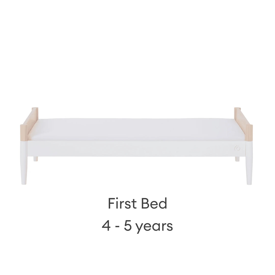 Convertible baby cot transformed into first bed for ages 4–5 years in natural wood and white finish
