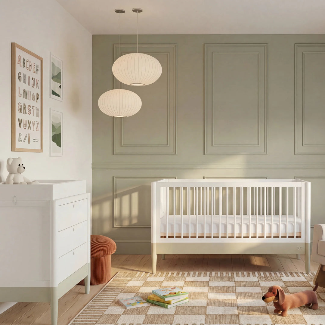 Gaia Baby Eos convertible cot bed white and cashmere in modern nursery with dresser storage unit and wooden floor baby crib setup