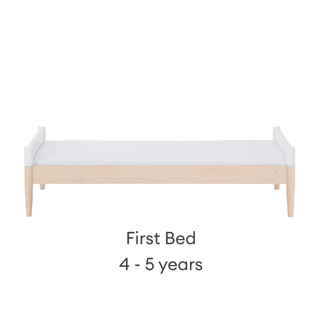 Gaia Baby Eos convertible cot bed transformed into first bed white and natural wood 4 to 5 years children’s bed modern kids bed front view