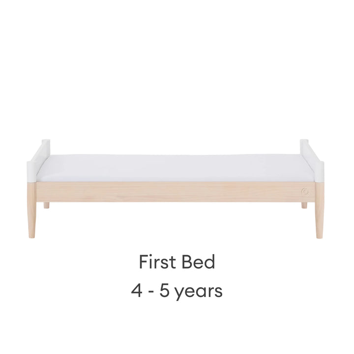 Gaia Baby Eos convertible cot bed transformed into first bed white and natural wood 4 to 5 years children’s bed modern kids bed front view