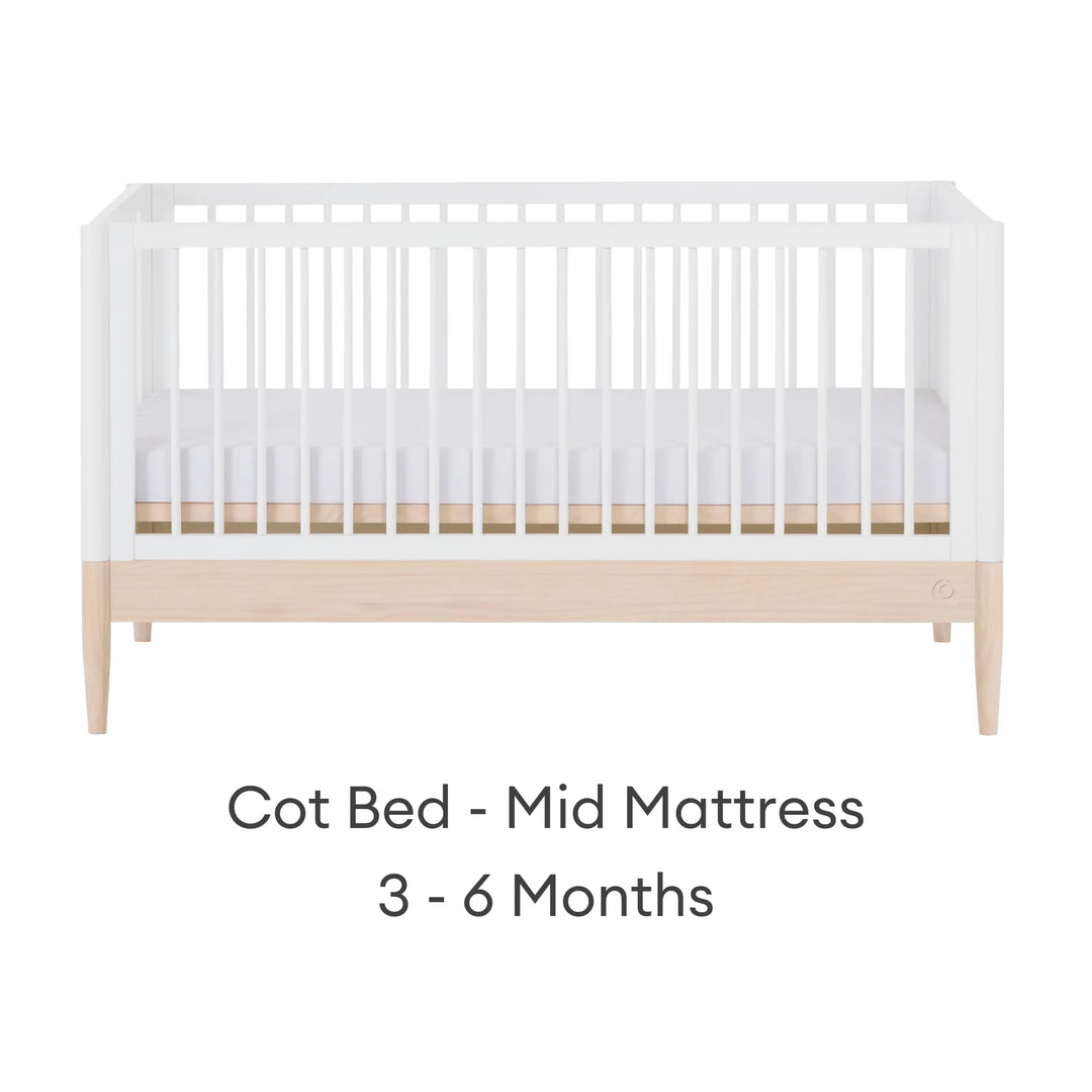 Gaia Baby Eos convertible cot bed white and natural wood mid mattress setting for baby 3 to 6 months adjustable cot bed front view