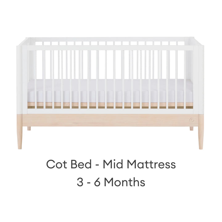 Gaia Baby Eos convertible cot bed white and natural wood mid mattress setting for baby 3 to 6 months adjustable cot bed front view
