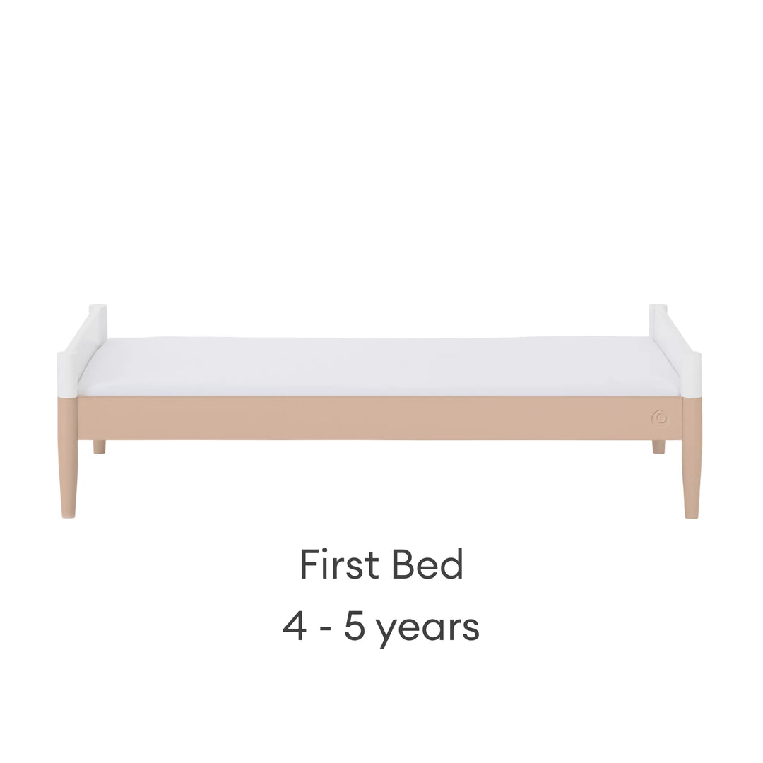 Gaia Baby Eos convertible cot in white and powder blush configured as a first bed for 4–5 years on a white background.