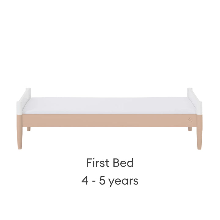 Gaia Baby Eos convertible cot in white and powder blush configured as a first bed for 4–5 years on a white background.