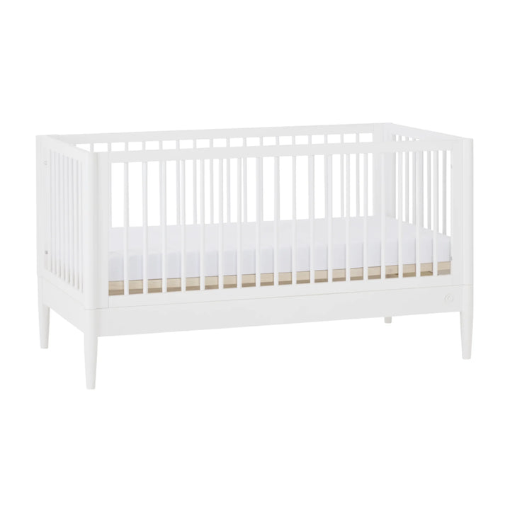 Gaia Baby Eos convertible cot bed in white, angled view on a white background