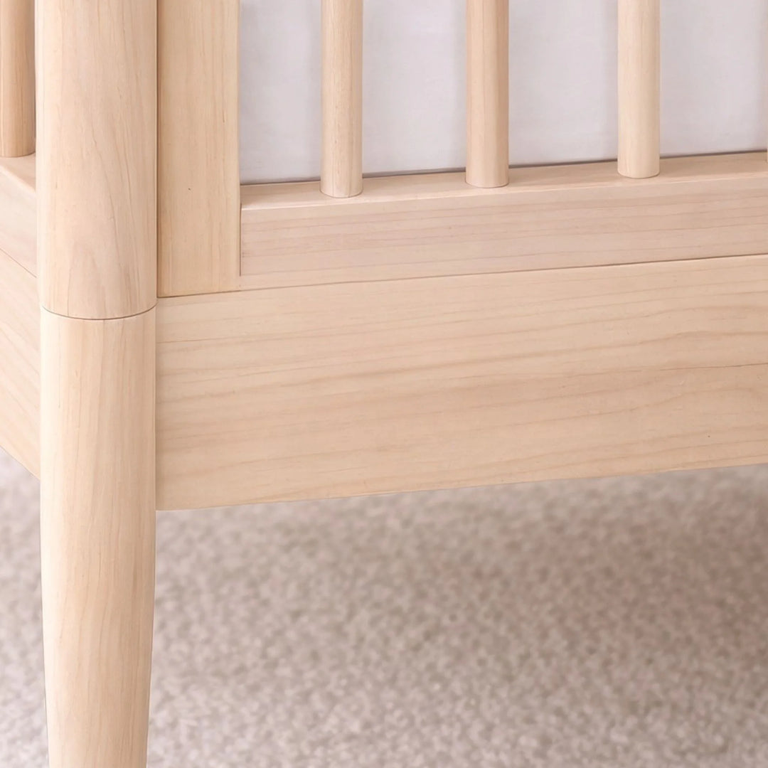 Gaia Baby Eos cot bed in all natural wood close-up showing frame and spindle detail