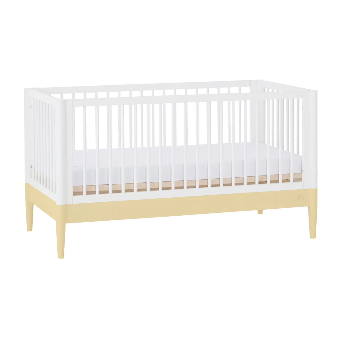 Gaia Baby Eos cot bed in white and yellow angled view on a white background