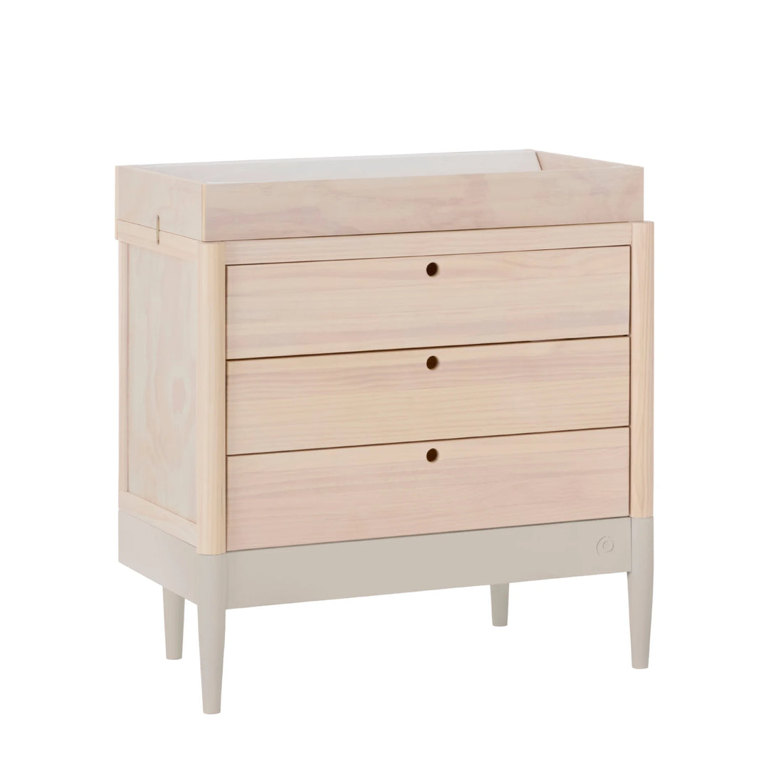 Gaia Baby Eos dresser with changing top in natural wood and cashmere, angled view with three drawers for nursery storage
