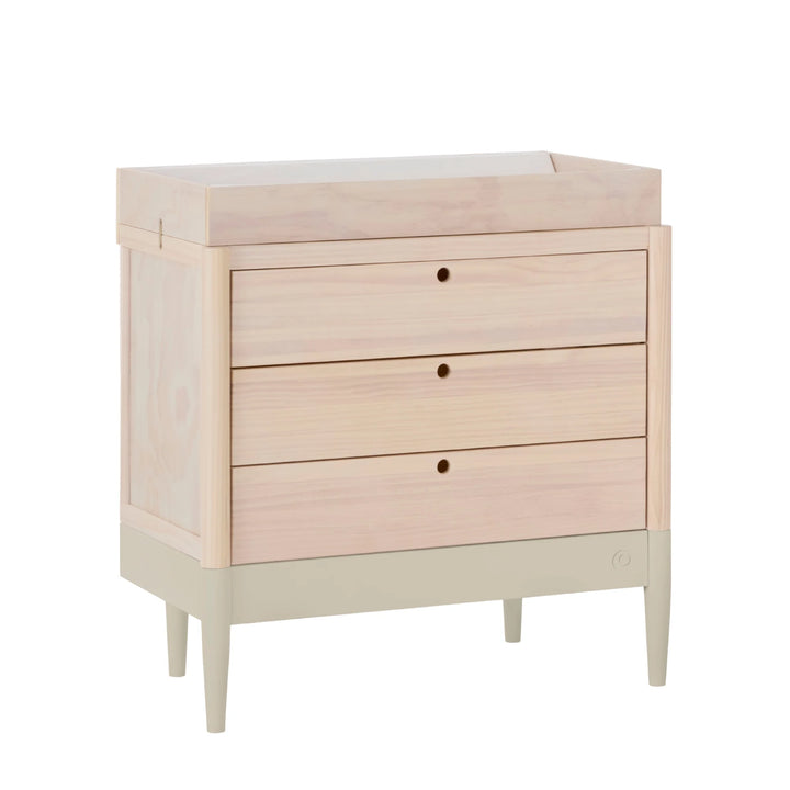 Gaia Baby Eos dresser in natural wood and desert sage with changing top, angled view