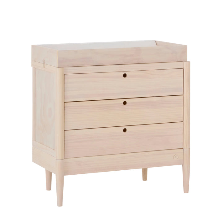 Gaia Baby Eos dresser in natural wood with changing top, angled view
