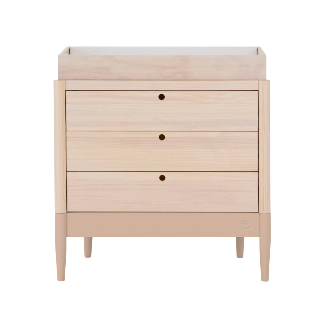Gaia Baby Eos dresser with changer in natural wood and powder blush on a white background