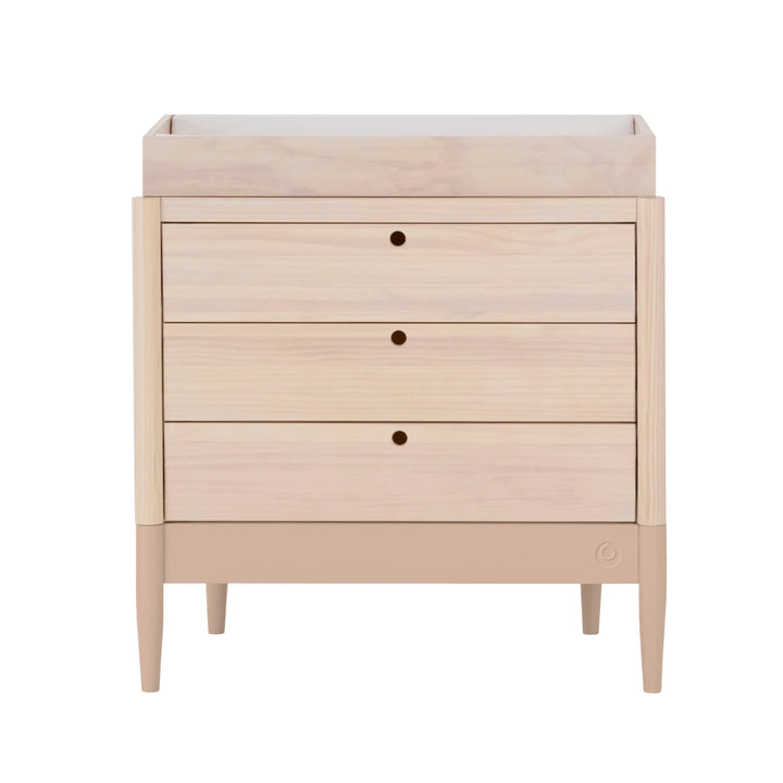 Gaia Baby Eos dresser with changer in natural wood and powder blush on a white background