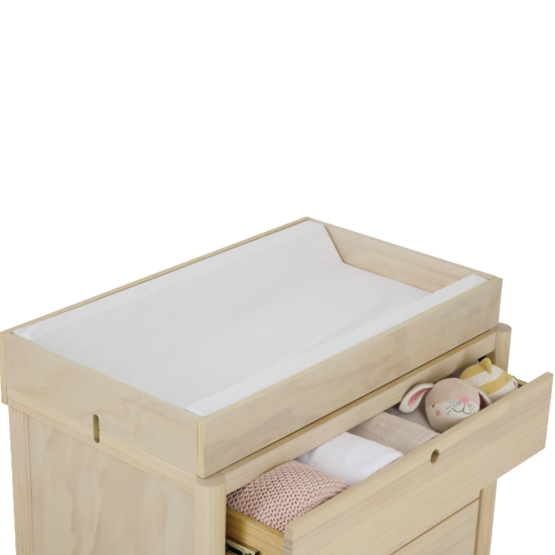 Natural wood baby dresser with changing top and open drawer storage, Gaia Baby Eos nursery changing unit with soft-close drawer.