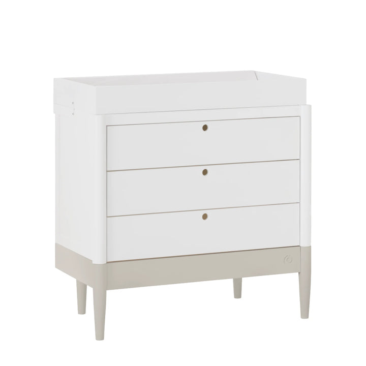 Gaia Baby Eos dresser with changer in white and cashmere base angled view on white background