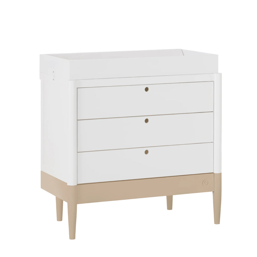 Gaia Baby Eos dresser in white and powder blush with changing top angled view on white background