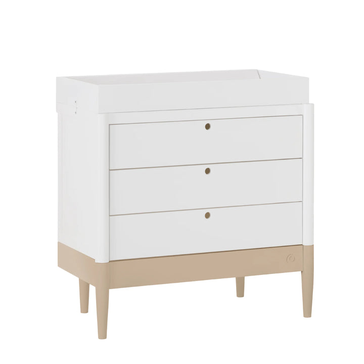 Gaia Baby Eos dresser in white and powder blush with changing top angled view on white background