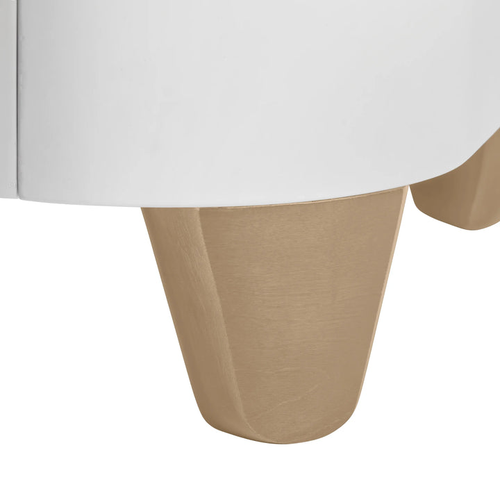 Close up of natural wood legs on Serena cot.