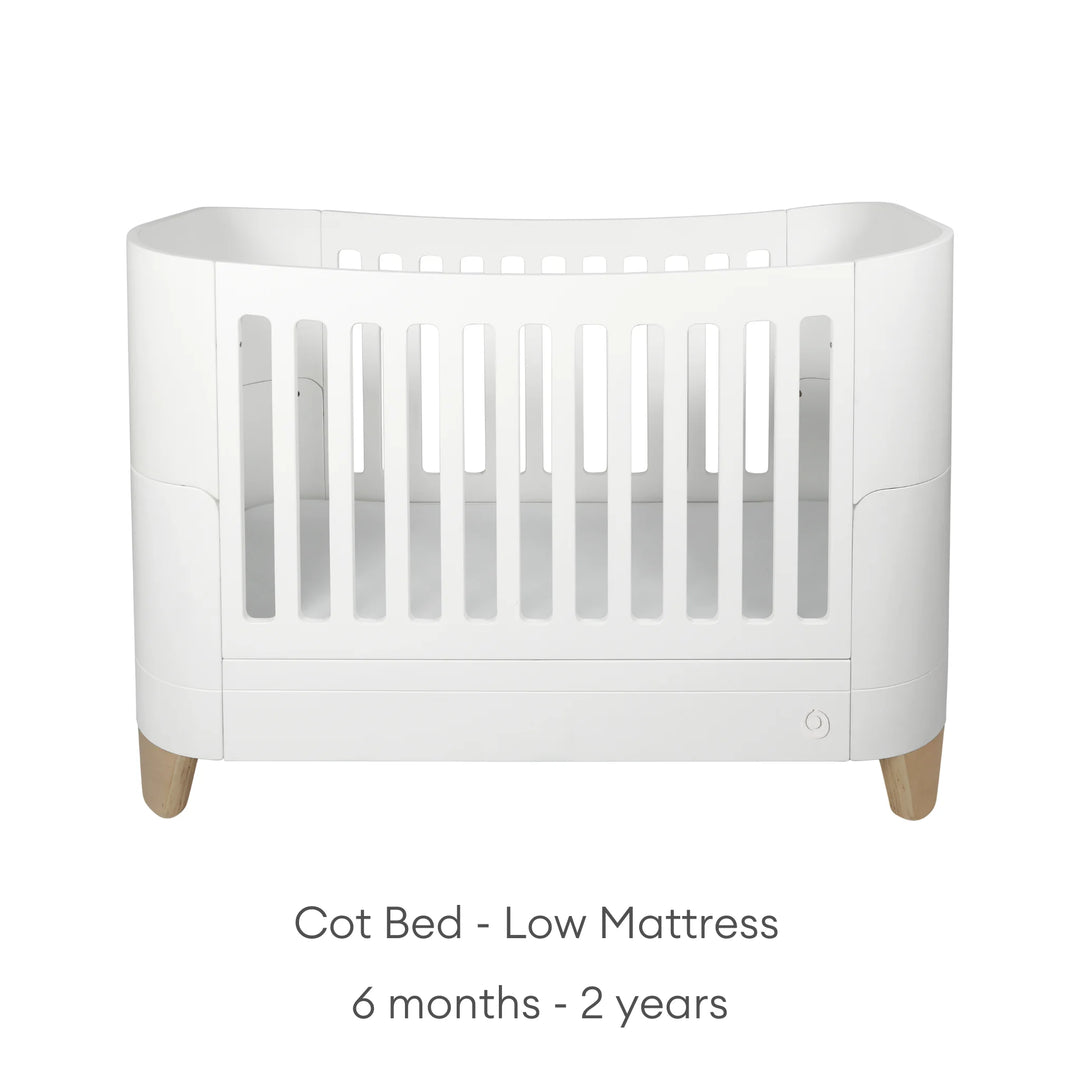 Serena Cot Bed on white background with text: Cot Bed - Low Mattress, 6 - 12  months.