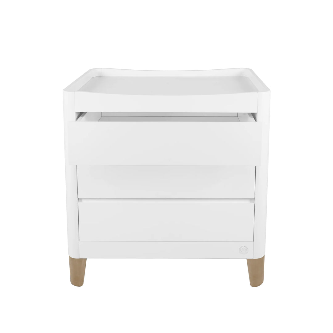 Gaia Baby Serena dresser in white with natural wood legs on a white background