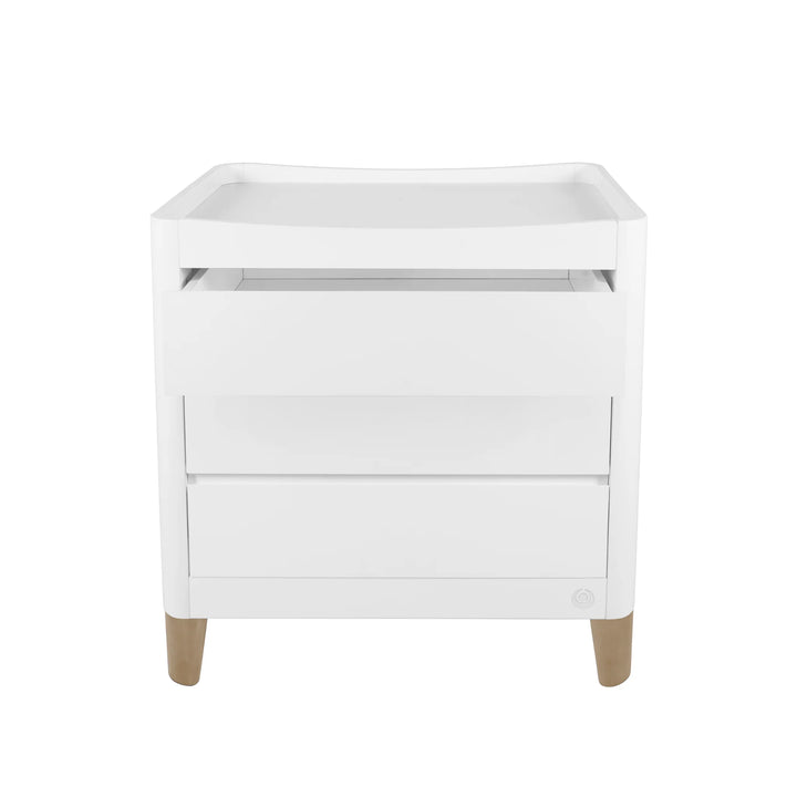 Gaia Baby Serena dresser in white with natural wood legs on a white background