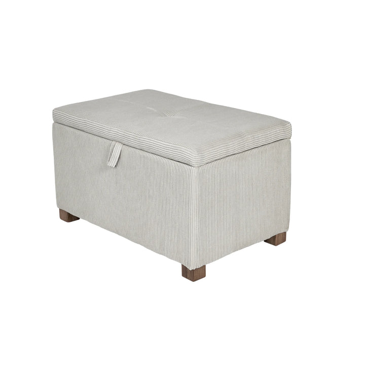 The Gaia Baby Serena Footstool in ecru corduroy fabric shown as a hero product shot on a white background, featuring a soft upholstered storage ottoman with textured corduroy finish and dark wooden feet.