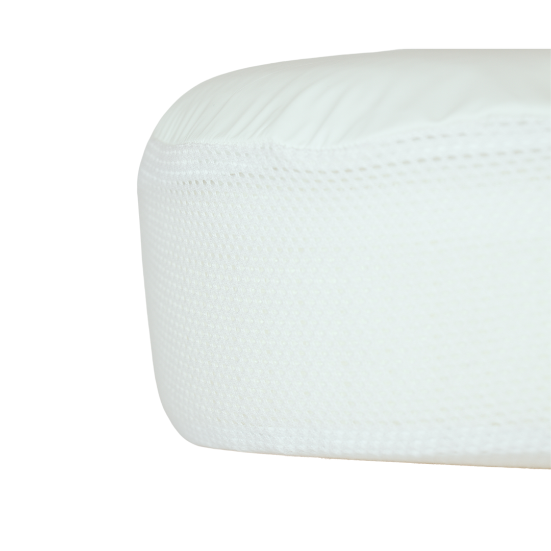 Close-up of Gaia Baby Serena Mini Cot mattress protector showing breathable 3D mesh sides and waterproof top for safe, hygienic baby sleep.