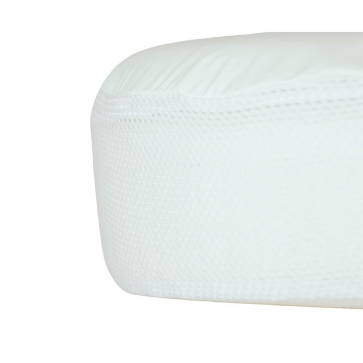 Close-up of Gaia Baby Serena Mini Cot mattress protector showing breathable 3D mesh sides and waterproof top for safe, hygienic baby sleep.