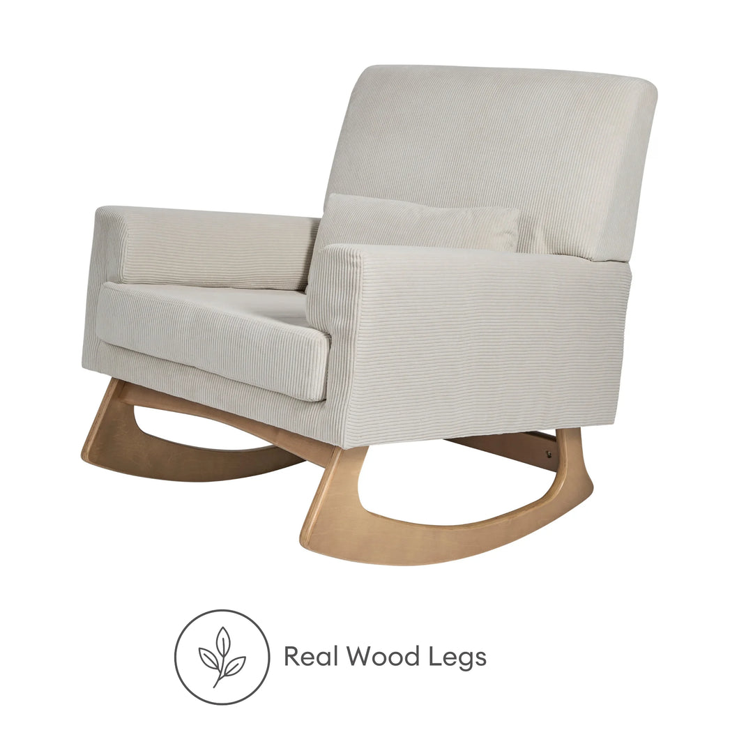 Angled view of the Gaia Baby Serena Rocking Nursing Chair in soft ecru corduroy fabric with natural real wood rocking legs, highlighting the chair’s premium craftsmanship, smooth rocking motion, and timeless nursery design.