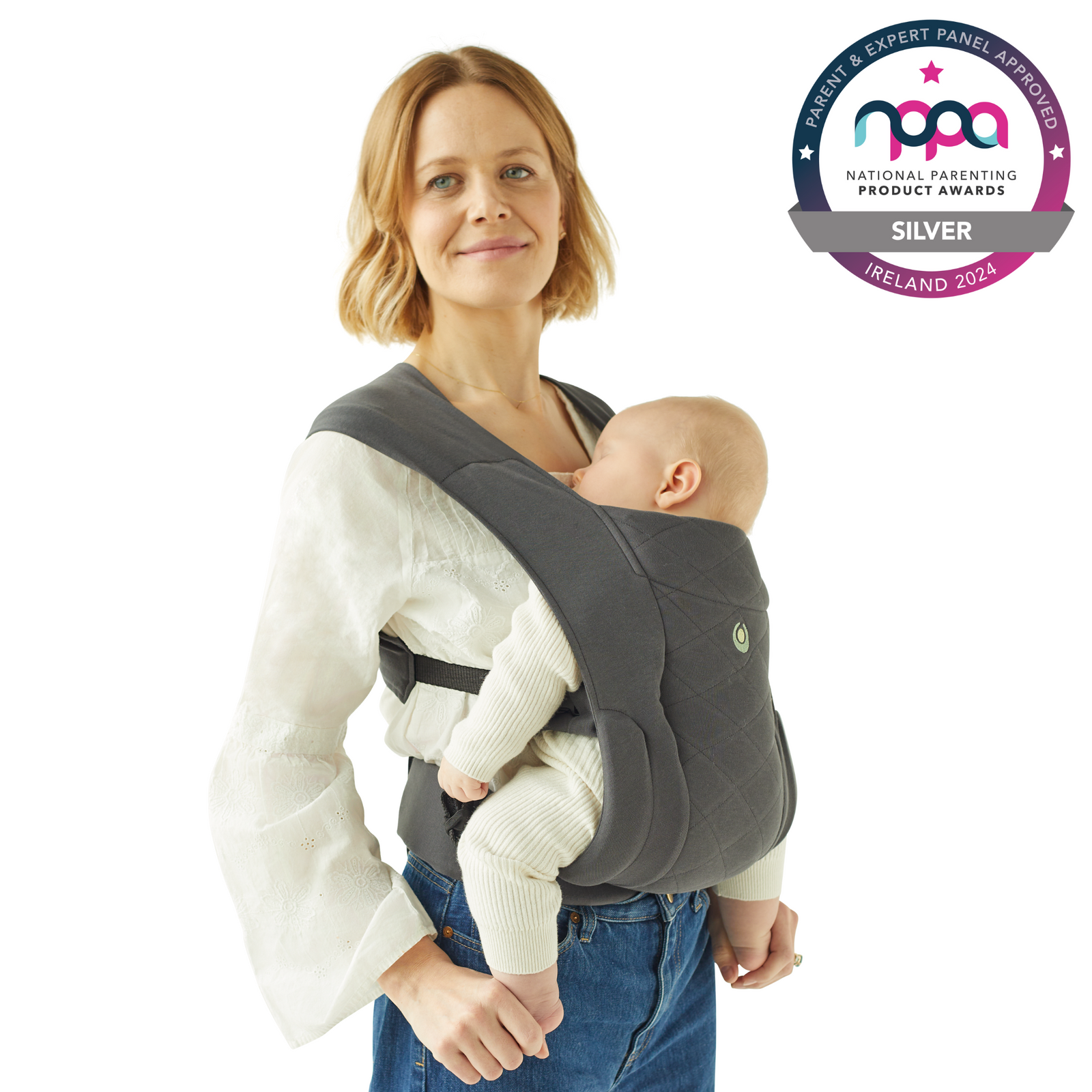 Mother carrying baby in ClevaMama Baby Carrier – ergonomic soft structured carrier with breathable fabric for newborns and infants, supportive and comfortable design, award-winning Silver at National Parenting Product Awards 2024 Ireland.