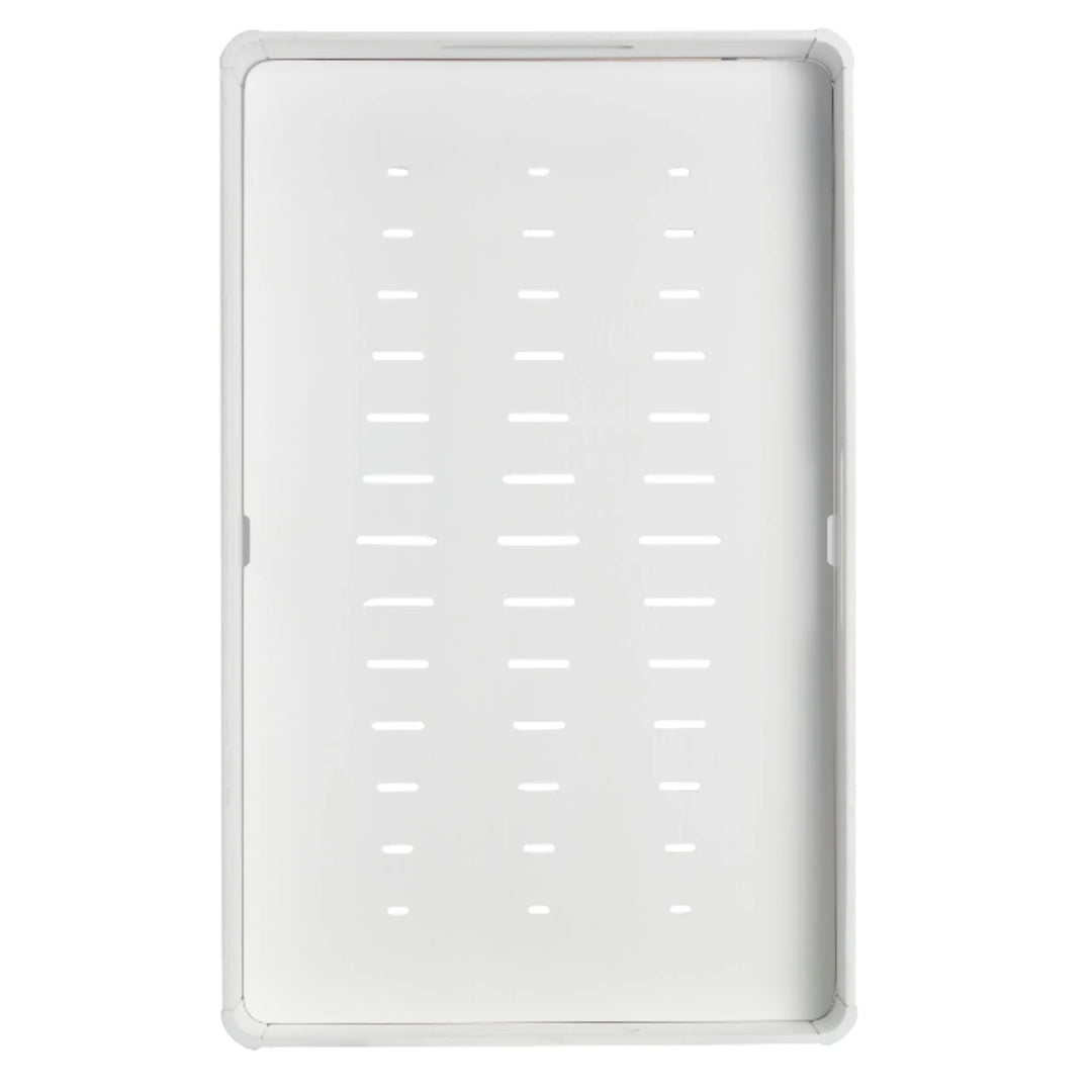 Underside of Gaia Baby Hera white changing station showing secure ventilation slats and slip-resistant base designed to safely attach to dressers.