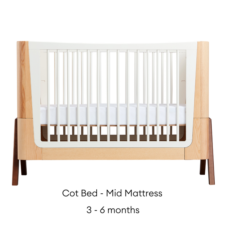 Hera Cot Bed in Natural Ash and Walnut mid mattress suitable from three months to six months