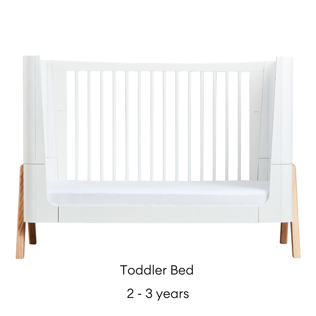 Gaia Baby Hera Cot Bed in Scandi White and Natural. Shows the Toddler Bed as transformed to a Toddler bed that is suitable for toddlers aged two to three years