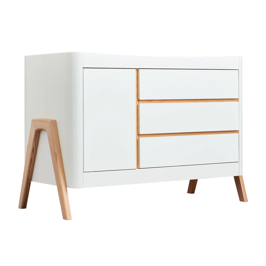 Gaia Baby Hera dresser in natural Scandi white finish, featuring minimalist modern design with three smooth-glide drawers, soft-close cabinet door, and solid wood A-frame legs — stylish Scandinavian nursery storage furniture.