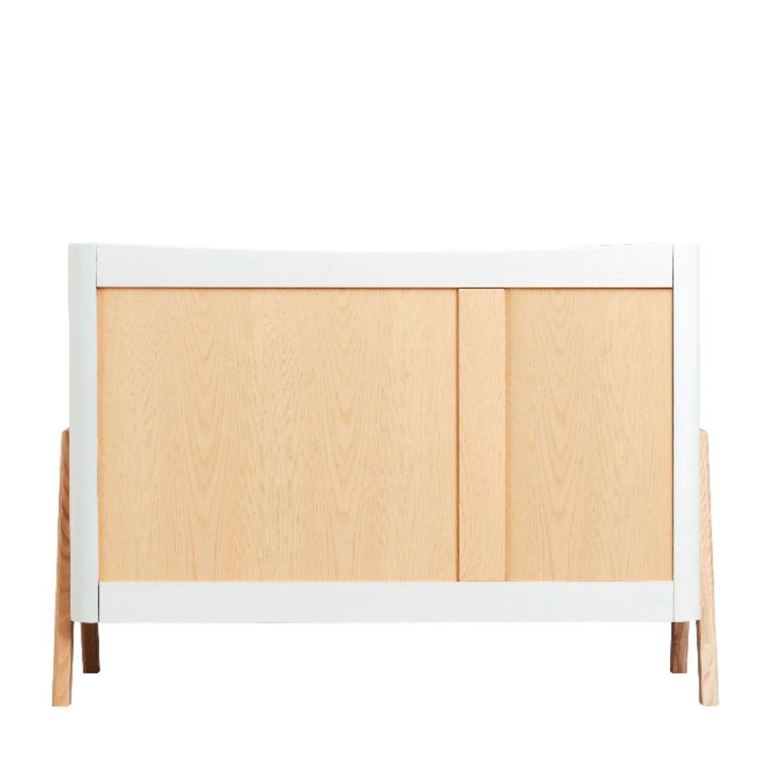 Back view of the Gaia Baby Hera dresser in Scandi white and natural wood, showcasing minimalist Scandinavian design with solid ash wood panels and raised A-frame legs.