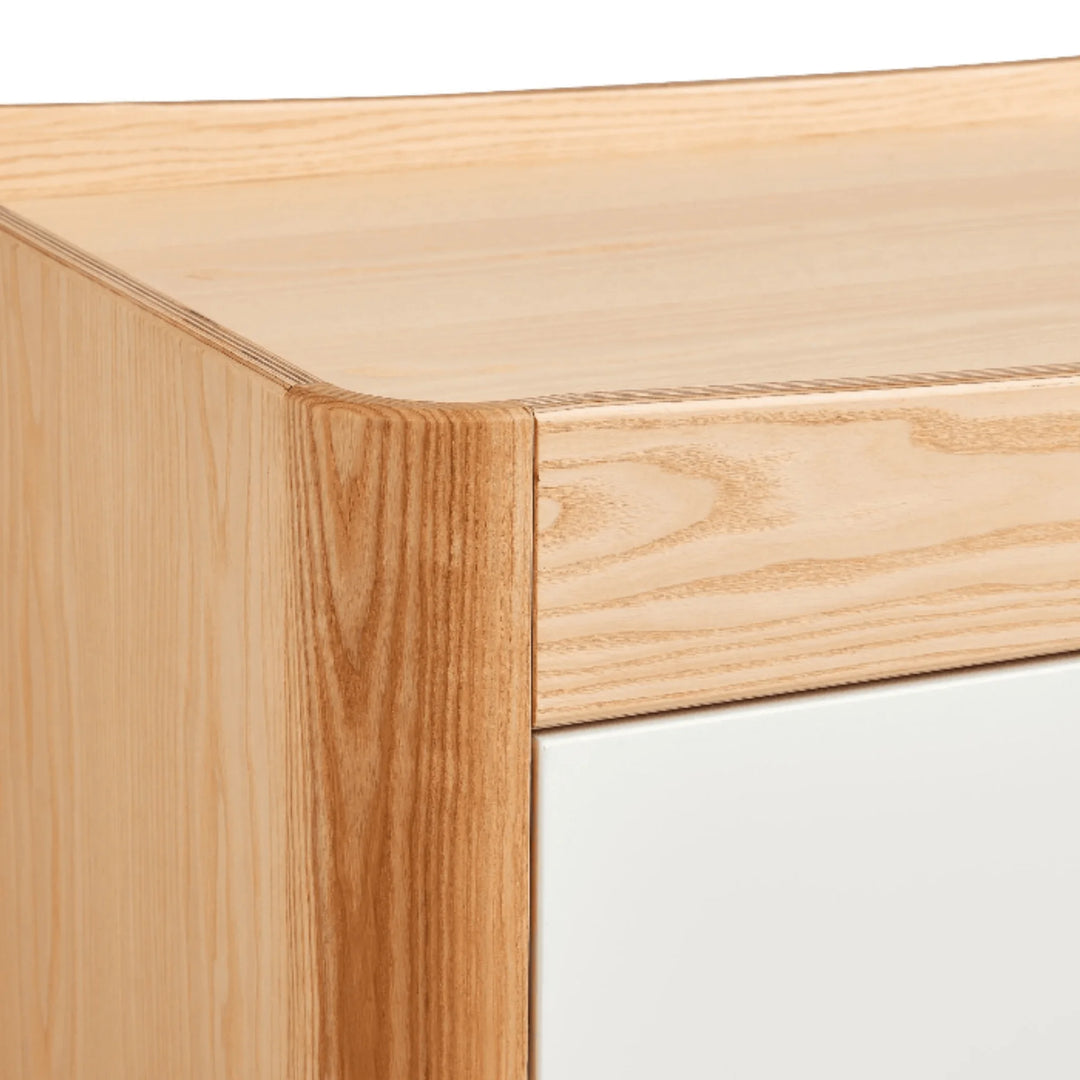 Close-up of the Gaia Baby Hera dresser in Scandi white and natural ash wood, highlighting the smooth rounded corner design, premium wood grain and Scandinavian craftsmanship.