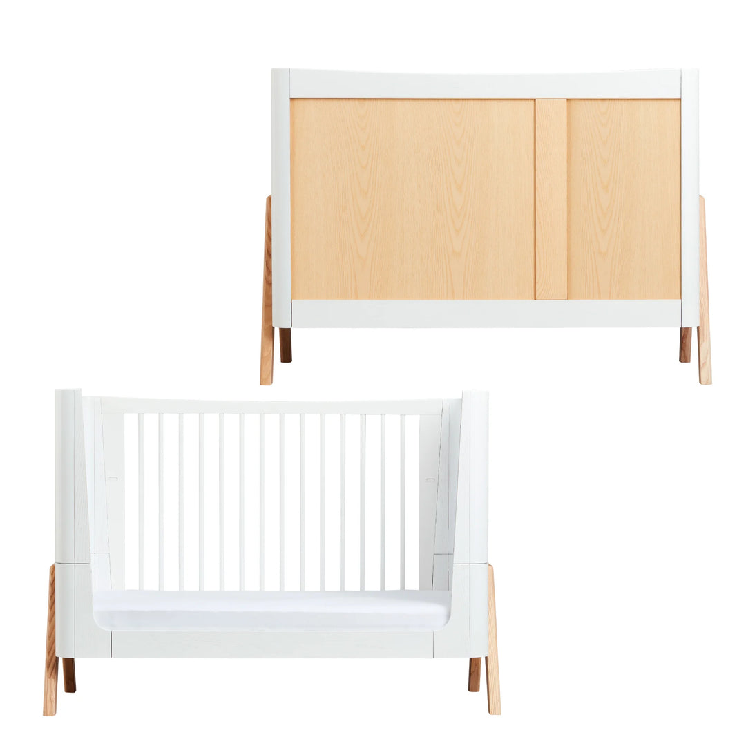 “Gaia Baby Hera nursery furniture set featuring the Hera dresser with natural wood doors and white frame, paired with the matching Hera cot bed in white with natural wood legs; modern Scandinavian-style eco-friendly baby furniture for contemporary nursery design