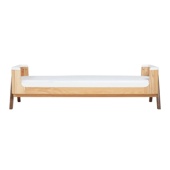 Gaia Baby Hera junior bed extension in natural ash and walnut, extended low toddler bed configuration with minimalist Scandinavian design.