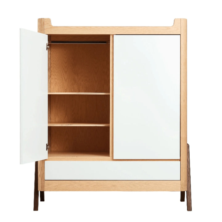 Gaia Baby Hera wardrobe in Scandi white and natural wood shown open to display adjustable oak shelves, spacious interior storage and soft-close door design.