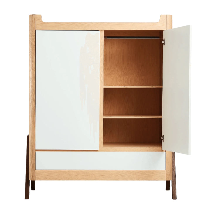 Gaia Baby Hera wardrobe in Natural Ash and Walnut shown open from the front, featuring adjustable oak shelving and a hanging rail for organised nursery clothing storage.