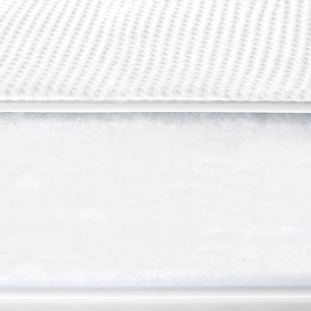 Close-up of Gaia Baby Serena cot bed mattress showing breathable textured surface
