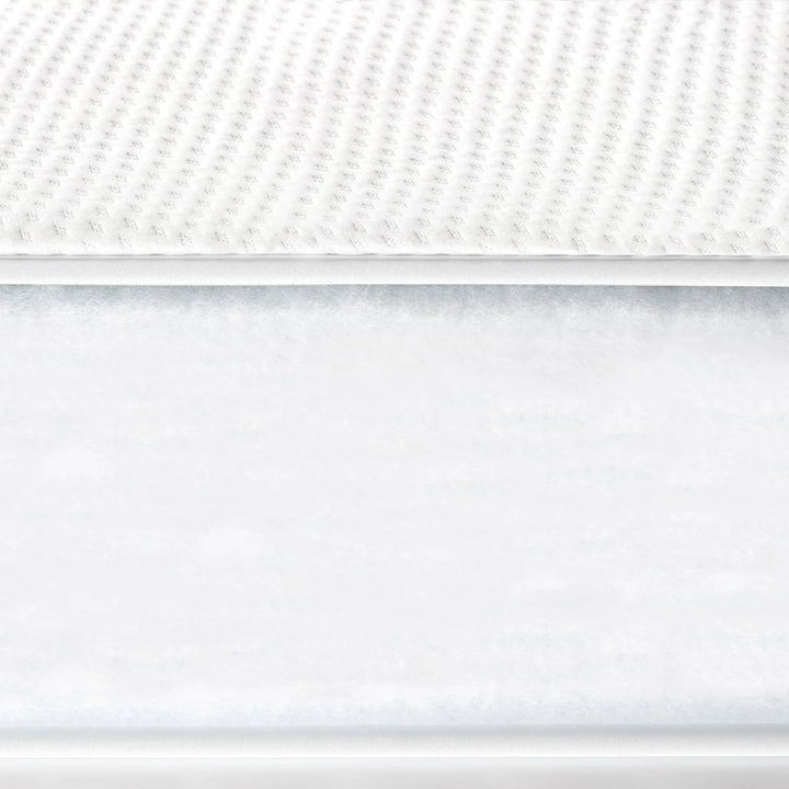 Close-up of Gaia Baby Serena cot bed mattress showing breathable textured surface