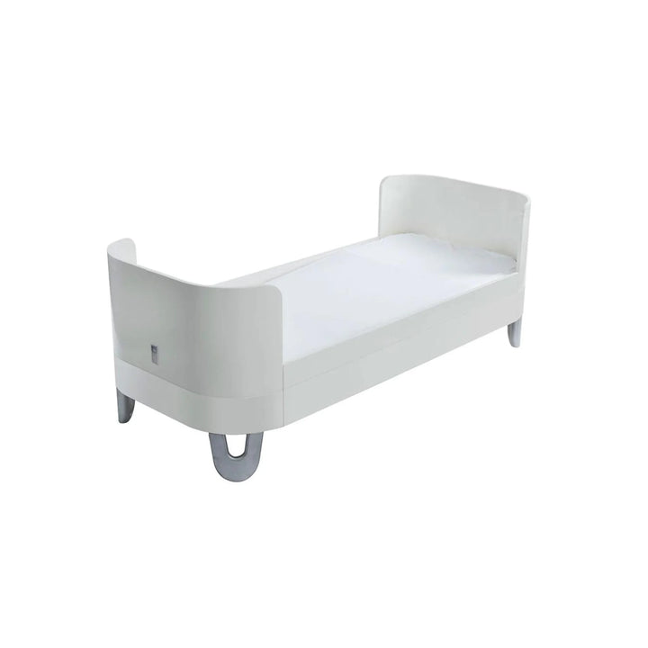 Gaia Baby Serena Junior Bed Extension in all-white finish, converted from the Serena Cot Bed into an extended junior bed with curved ends and grey legs.