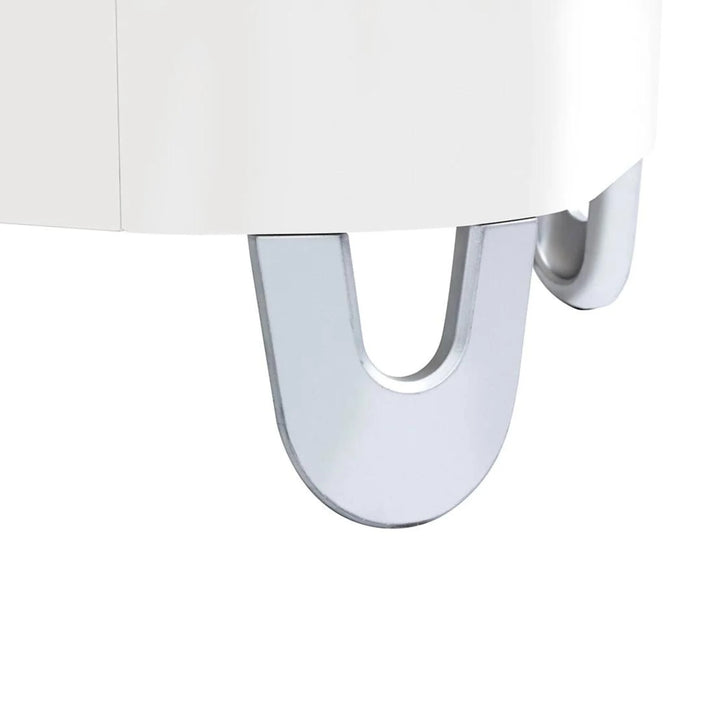 Close-up of Gaia Baby Serena Junior Bed Extension showing the signature silver U-shaped legs on the all-white Serena cot bed transition design.