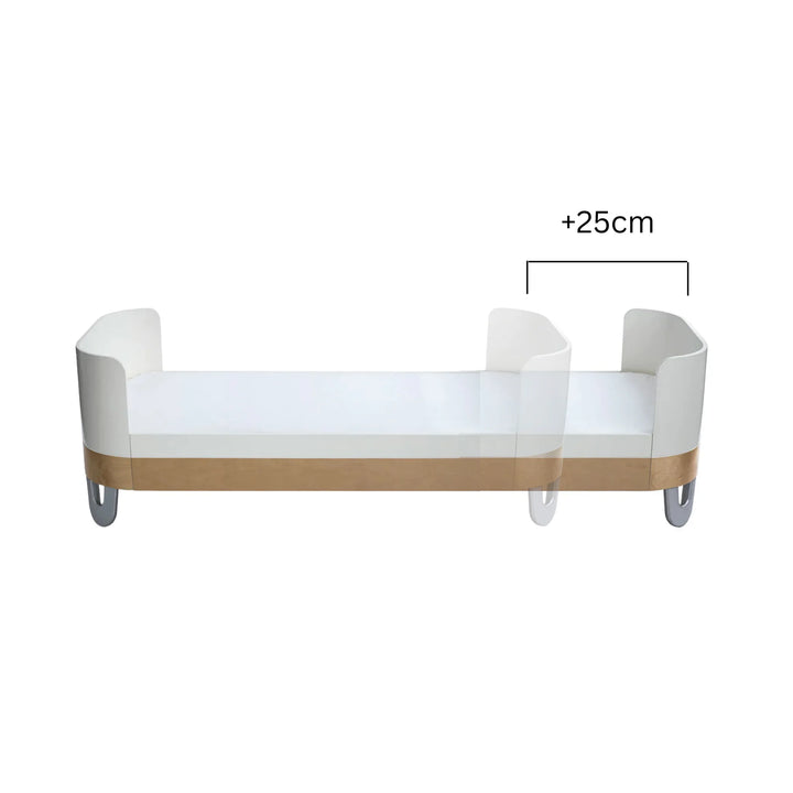 Gaia Baby Serena Junior Bed Extension for Serena Cot Bed in white with natural wood trim, showing +25cm length increase to convert the cot into an extended junior bed.