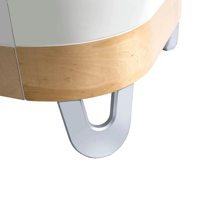 Close-up of Gaia Baby Serena Junior Bed Extension showing natural wood detail and signature silver U-shaped legs for the Serena Cot Bed.